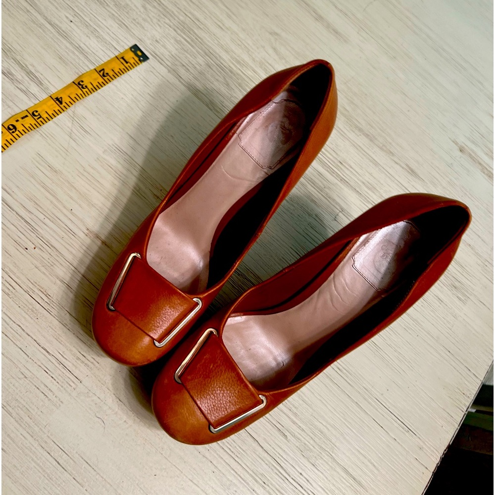 Prada camel color, thick, high heels w/ silver detailing. Size 9/40 women’s